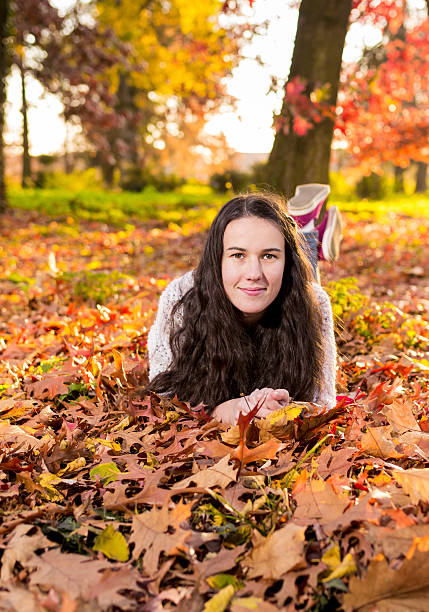 istock Woman portret in autumn leaf 527344259