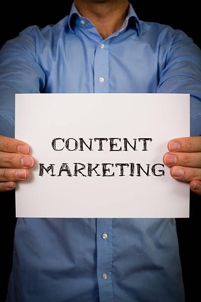 istock Man with Content Marketing sign 527344379