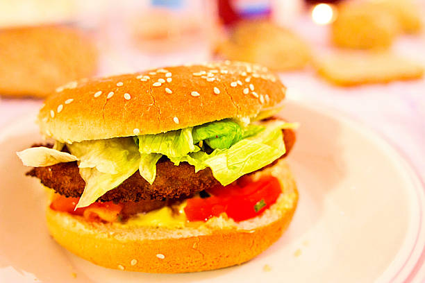 istock chicken burger with salad and tomatoes 527346023