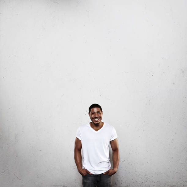 istock Young man in white t-shirt smiling 527349231