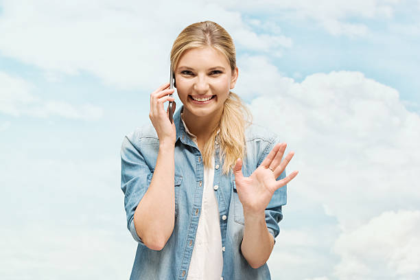istock Cheerful woman on mobile & waving hand 527367805
