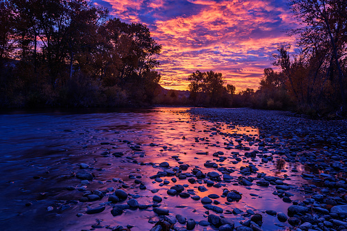 Beautiful and dramatic sunrise along Boise River in Boise, Idaho, USA on a fine autumn morning. It was such an intense color display on that morning and I was so lucky to witness it and I am glad I created this beautiful image. Getting early is hard but it has its own bonus!