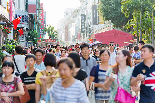 Large group of people walking along the pedestrian area in China.