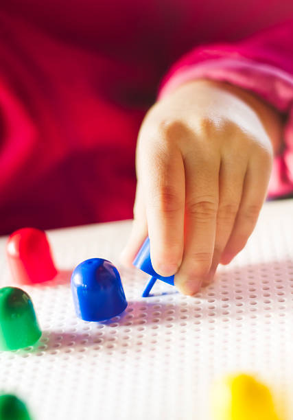 Educational toy for development of fine motor skills. Especially useful for children with physical and mental impairments. AdobeRGB profile.