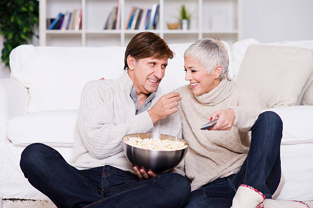 istock Mature couple watching TV 527370139
