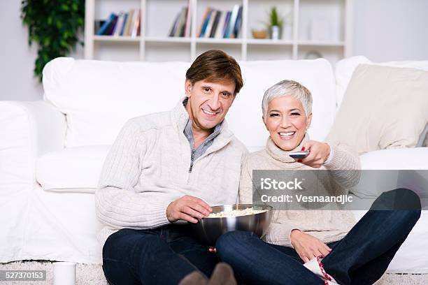 Mature Couple Watching Tv Stock Photo - Download Image Now - 40-44 Years, 50-59 Years, Adult