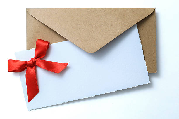 istock Christmas brown envelope with ribbon 527370517