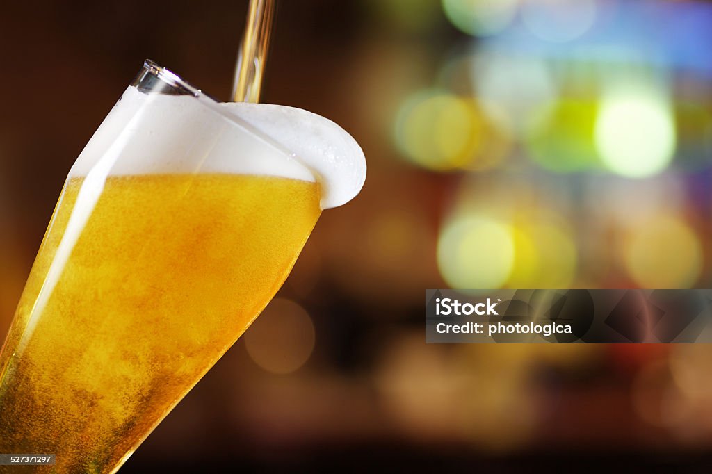 Glass of beer Inclined Glass of beer  Beer - Alcohol Stock Photo