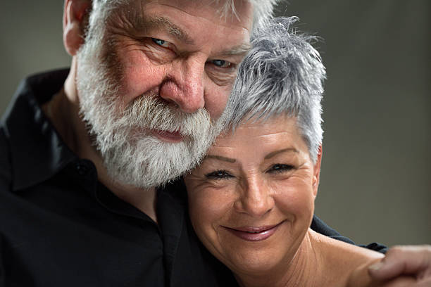 istock portrait Senior couple embracing each other, looking at camera. 527371851