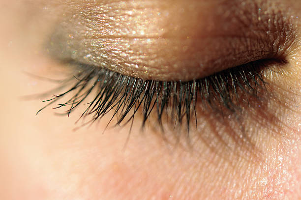 istock Close-up of closed eye with long eyelashes macro 527372045