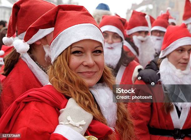 Smiling Girl At The Santa Clause Parade Stock Photo - Download Image Now - Adult, Bag, Beautiful People