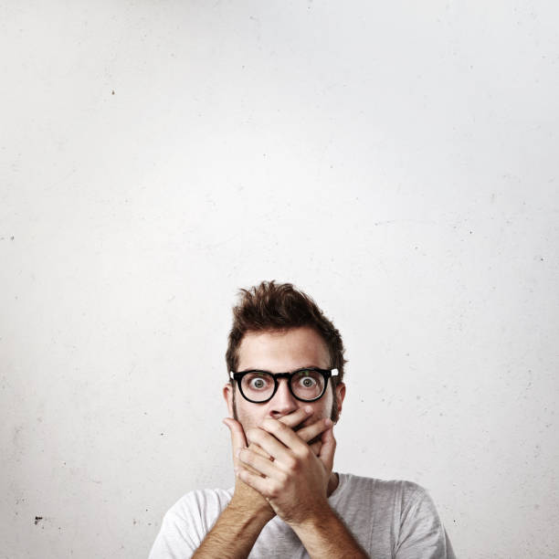 istock Portrait of a shocked young man 527374151