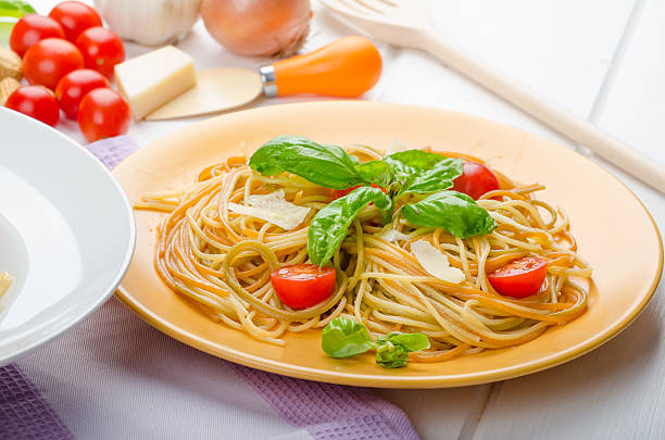 istock Lemon pasta with cherry tomatoes, basil and nuts 527375627