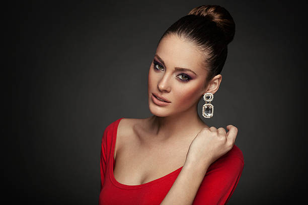 istock Beautiful woman posing in studio on dark background 527392661