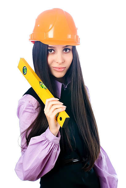 istock Attractive girl in helmet with level 527397501