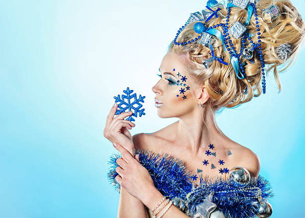 Young attractive blonde girl with creative hairdo christmas close-up portrait