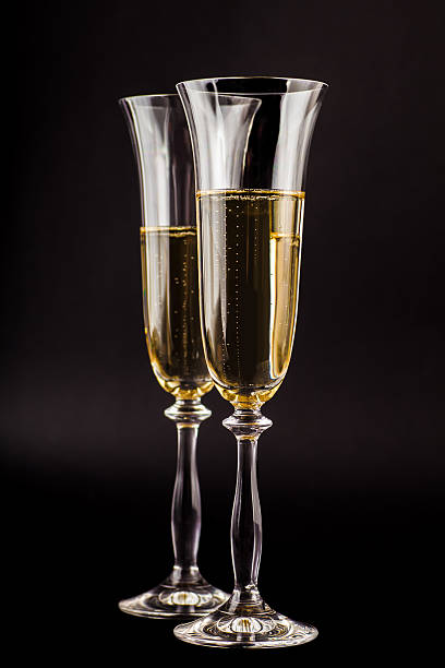 istock two glasses filled with champagne 527441591