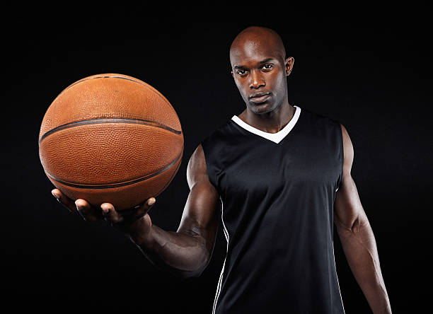 istock Confident young basketball player with a ball 527443843
