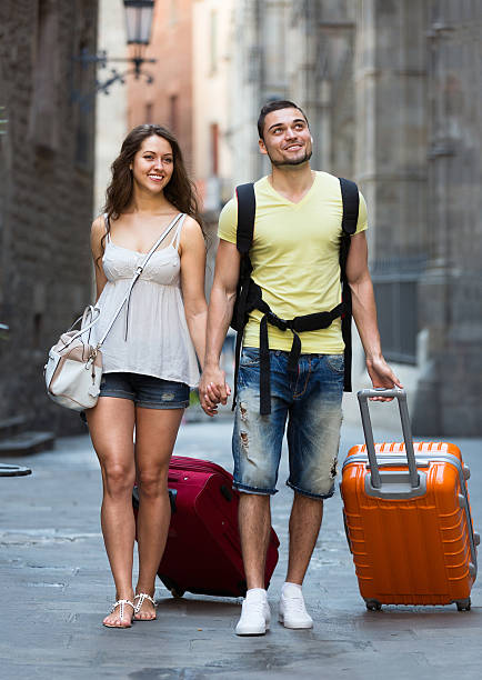 istock travelers with a backpack and suitcases 527445367