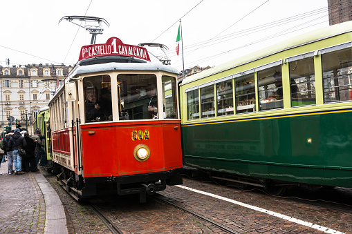 Turin, Italy - December 7, 2014 : The red historic tram in Castello Square for the Turin Trolley Festival