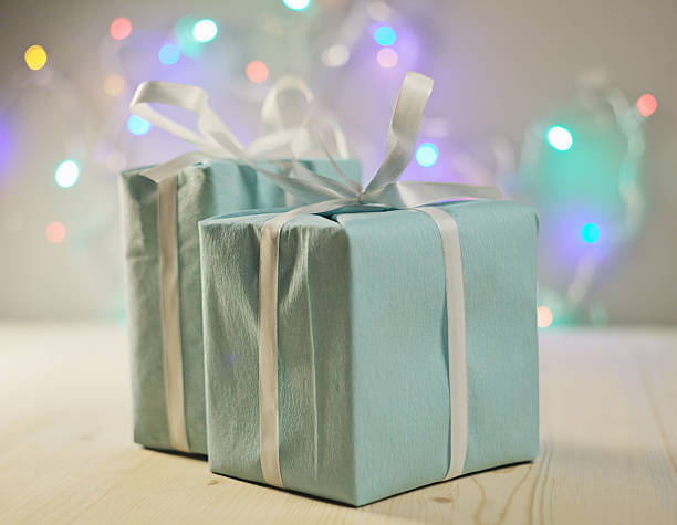 istock christmas gifts against bokeh lights background 527462637