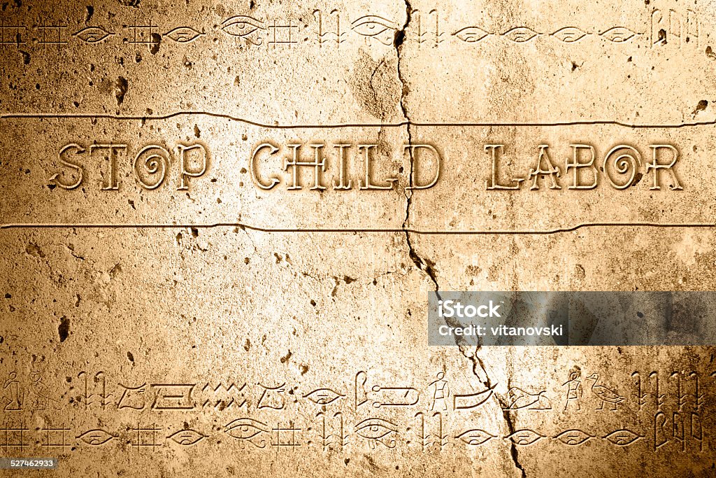 stop child labor word stop child labor on wall with egyptian alphabet made in 2d software Alphabet Stock Photo
