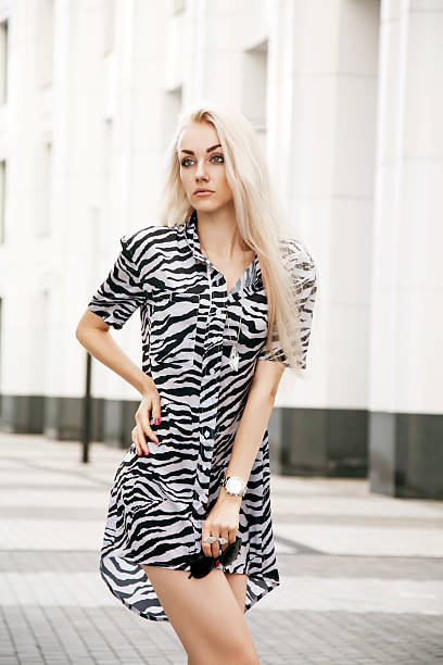 istock Stylish young woman posing outdoors 527466021