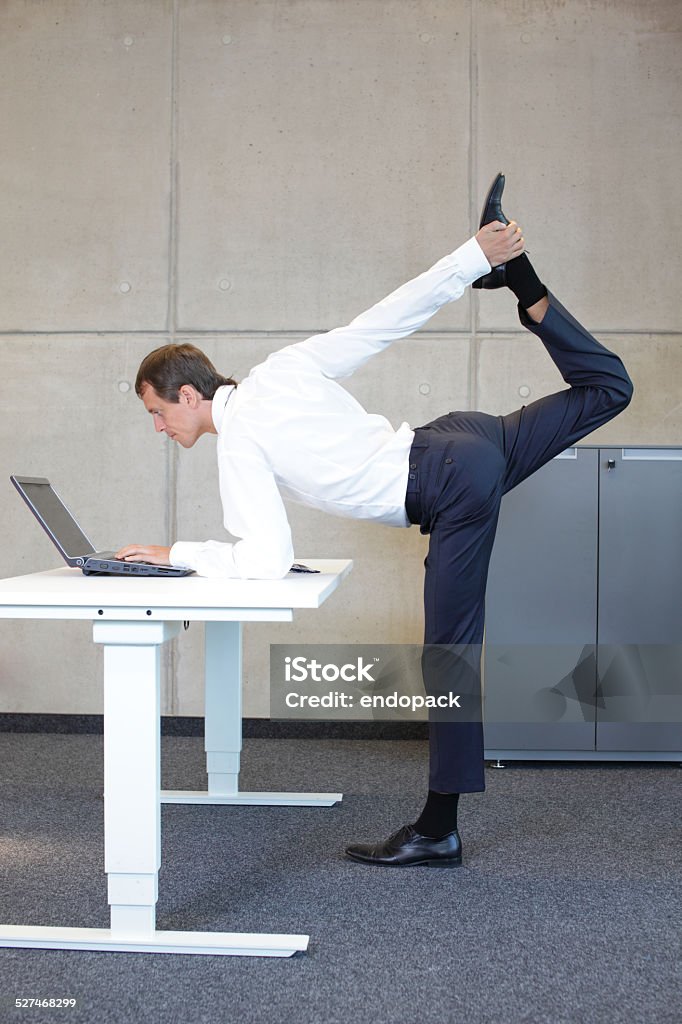 Business man v3.0 Business man v3.0 - Young fit ,corporate warrior as a healthy life icon at work Flexibility Stock Photo