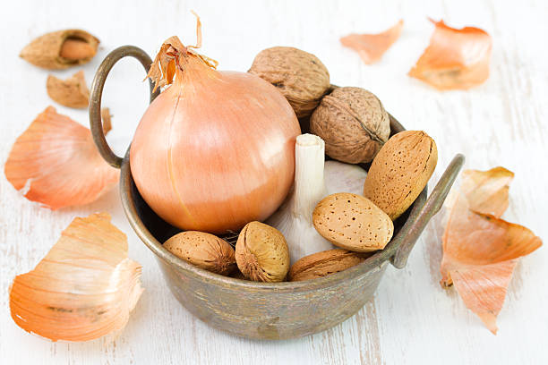 istock onion with garlic, almond and walnut 527468689
