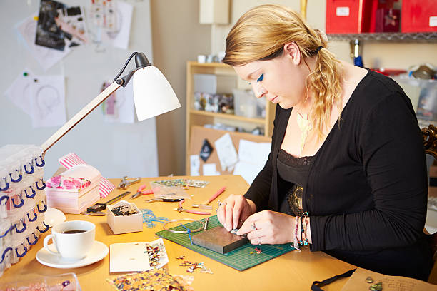 istock Young Woman Making Jewelry At Home 527469005