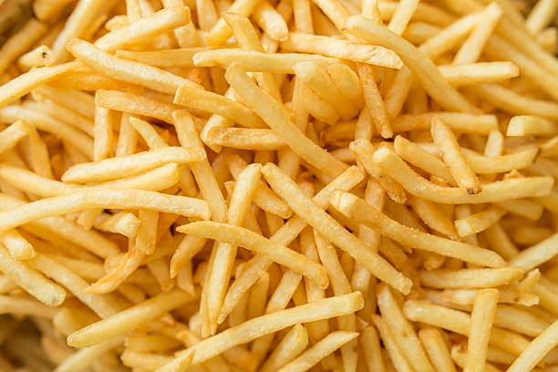 french fries pile of french fries french fries stock pictures, royalty-free photos & images