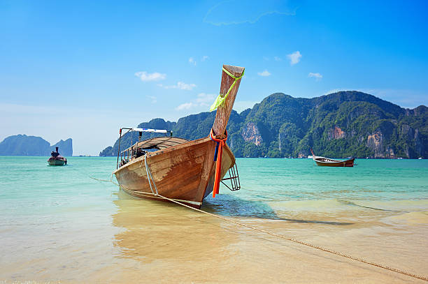 istock Longtail boat in the beautiful sea over clear sky 527477847
