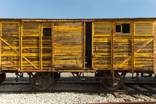 Old yellow wooden train wagon