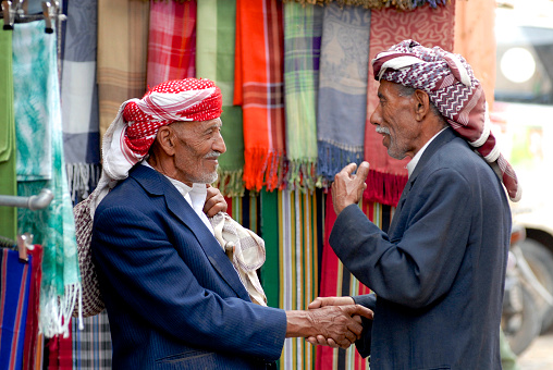 Sana'a, Yemen - September 18, 2006: Two unidentified men shake hands at the market on September 18, 2006 in Sana'a, Yemen.