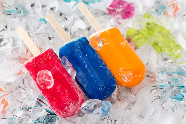 istock three colorful popsicles laying on a bed of ice 527484023