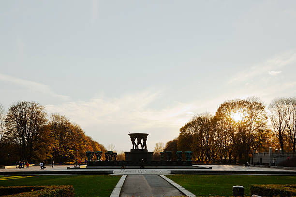 Sculpture park in Oslo at sunset. Oslo, Norway - October 30, 2014: Autumn colors in Gustav Vigeland Sculpture park in Oslo, Norway. norway autumn oslo tree stock pictures, royalty-free photos & images