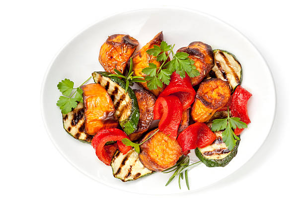 Vegetable Salad Vegetable salad with grilled red capsicum, sweet potato, zucchini and parsley. roasted stock pictures, royalty-free photos & images