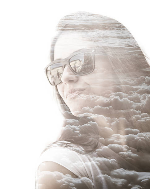 istock pretty woman looking away on the clouds 527494813