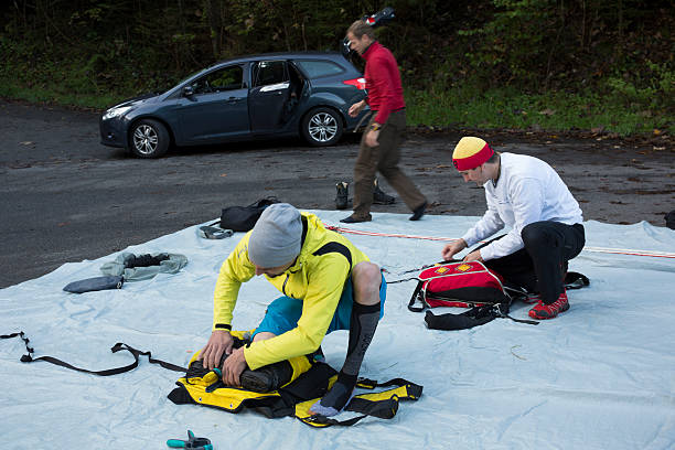 istock BASE jumpers prepare parachutes before making jump 527495103