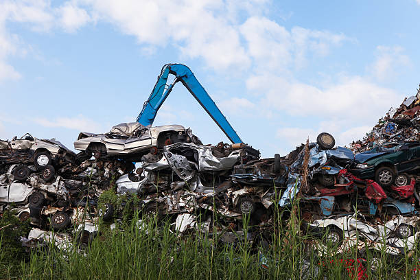 istock Scrap yard with crushed cars and blue sky 527495535