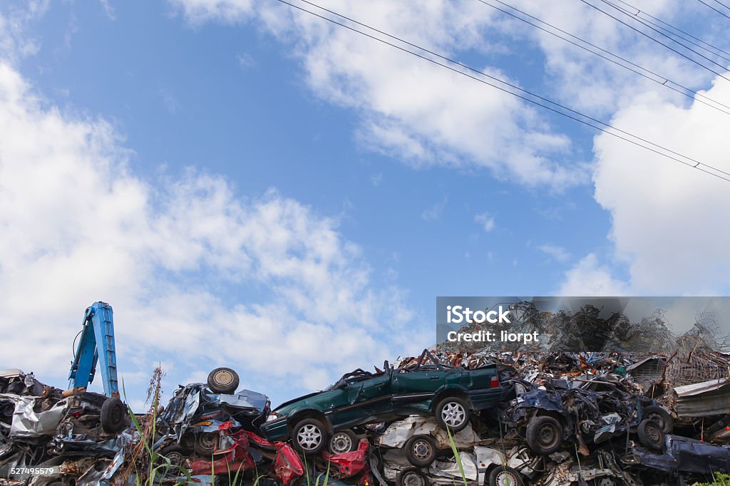 Scrap yard with crushed cars and blue sky Scrap Metal Stock Photo