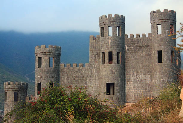 detail of the ancient castle of medieval battlemented Tower shape