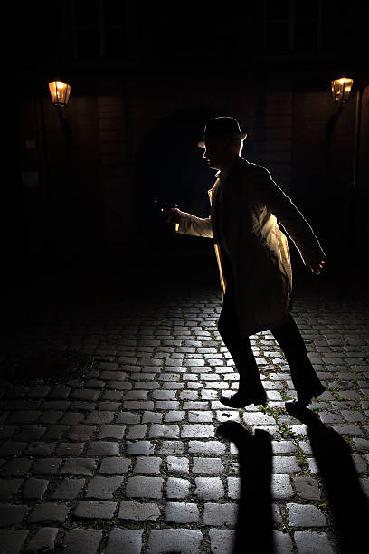 istock 1940s retro gangster running with a gun 527512541
