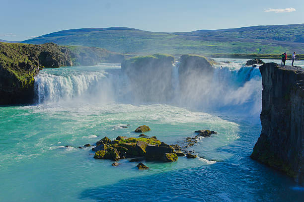 istock Beautiful vibrant panorama picture with view on waterfall in iceland 527514085