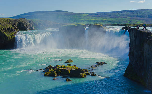 istock Beautiful vibrant panorama picture with view on waterfall in iceland 527514095