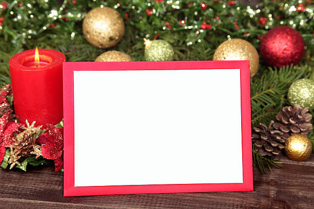 istock Christmas card or invitation with red envelope surrounded by decorations 527514617