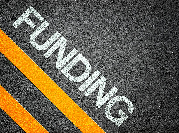 istock Funing Business Bank Banking Text Writing Road Asphalt 527516353
