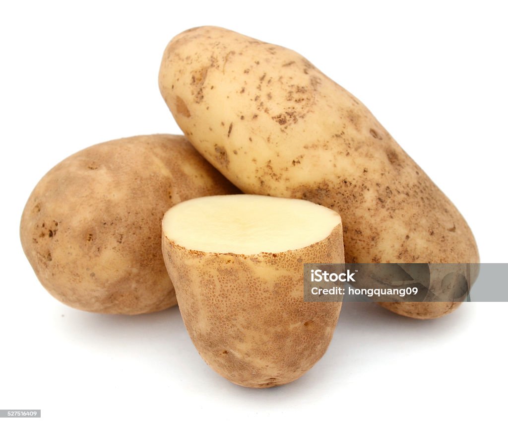 cutting and whole potatoes isolated cutting and whole potatoes isolated on white background Russet Potato Stock Photo