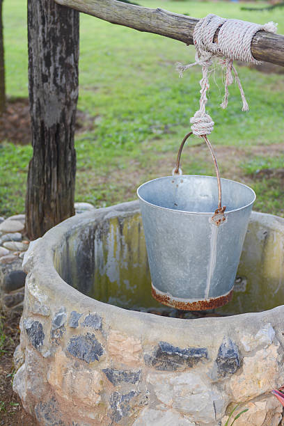 istock water tank over pond, farm 527516503