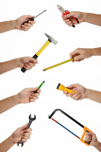 macho mãos com muitas ferramentas de aprimoramento da casa - maintenance engineer work tool hammer instrument of measurement - fotografias e filmes do acervo